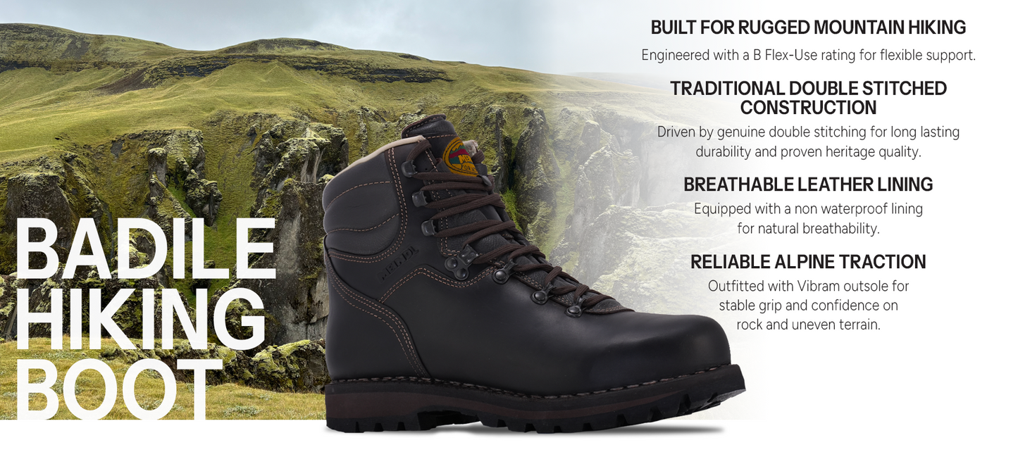 Meindl Badile Hiking Boot – Dark Brown Double-Stitched Leather Hiking Boot Against Scottish Highland Cliff Backdrop – Features: Built for Rugged Mountain Hiking With B Flex-Use Rating, Traditional Double Stitched Construction for Long Lasting Durability, Breathable Leather Lining With Non-Waterproof Natural Breathability, Reliable Alpine Traction With Vibram Outsole