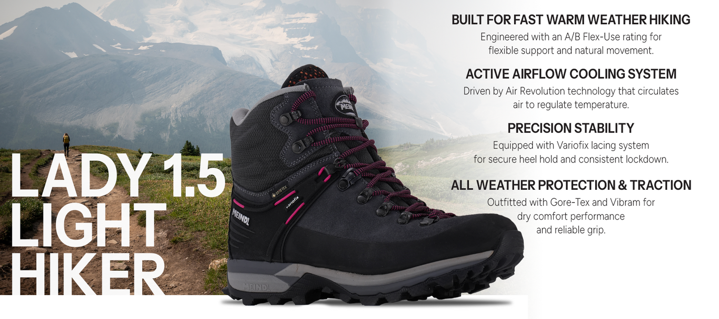 Meindl Lady Air Revolution Alpine 1.5 Light Hiker – Women's Dark Grey and Pink Gore-Tex Hiking Boot Against Glaciated Mountain Backdrop – Features: Built for Fast Warm Weather Hiking With A/B Flex-Use Rating, Active Airflow Cooling System With Air Revolution Technology, Precision Stability With Variofix Lacing System, All-Weather Protection and Traction With Gore-Tex and Vibram Outsole