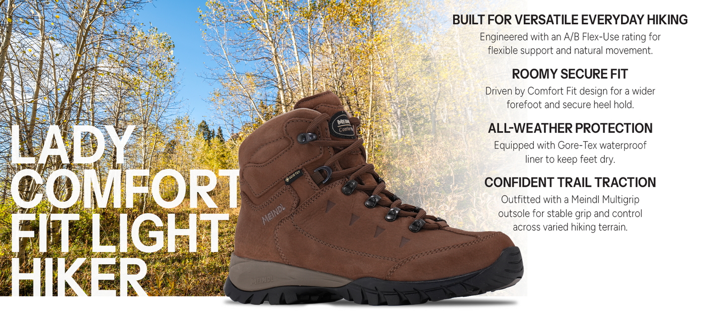 Meindl Lady Comfort Fit Light Hiker – Women's Brown Gore-Tex Leather Hiking Boot Against Autumn Aspen Backdrop – Features: Built for Versatile Everyday Hiking With A/B Flex-Use Rating, Roomy Secure Fit With Comfort Fit Design, All-Weather Protection With Gore-Tex Waterproof Liner, Confident Trail Traction With Meindl Multigrip Outsole