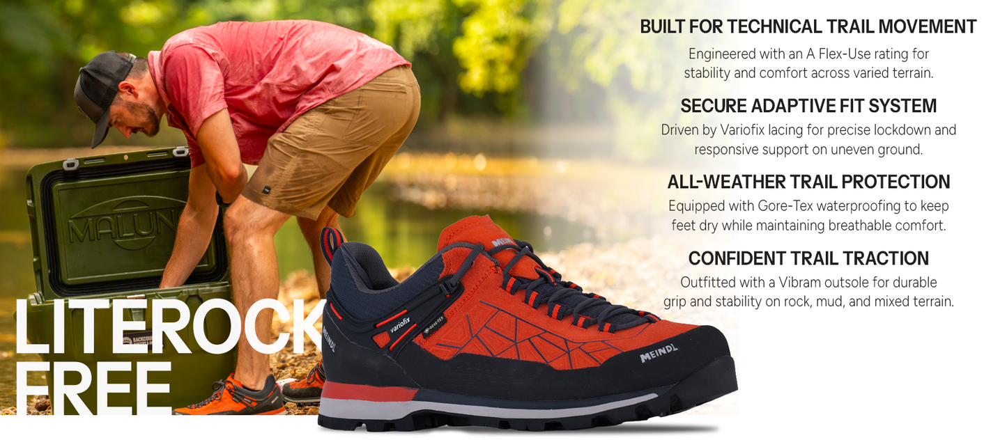 Meindl Literock Free Trail Shoe – Red and Navy Gore-Tex Trail Shoe With Man Lifting Malun Cooler at Riverside – Features: Built for Technical Trail Movement With A Flex-Use Rating, Secure Adaptive Fit System With Variofix Lacing, All-Weather Trail Protection With Gore-Tex Waterproofing, Confident Trail Traction With Vibram Outsole