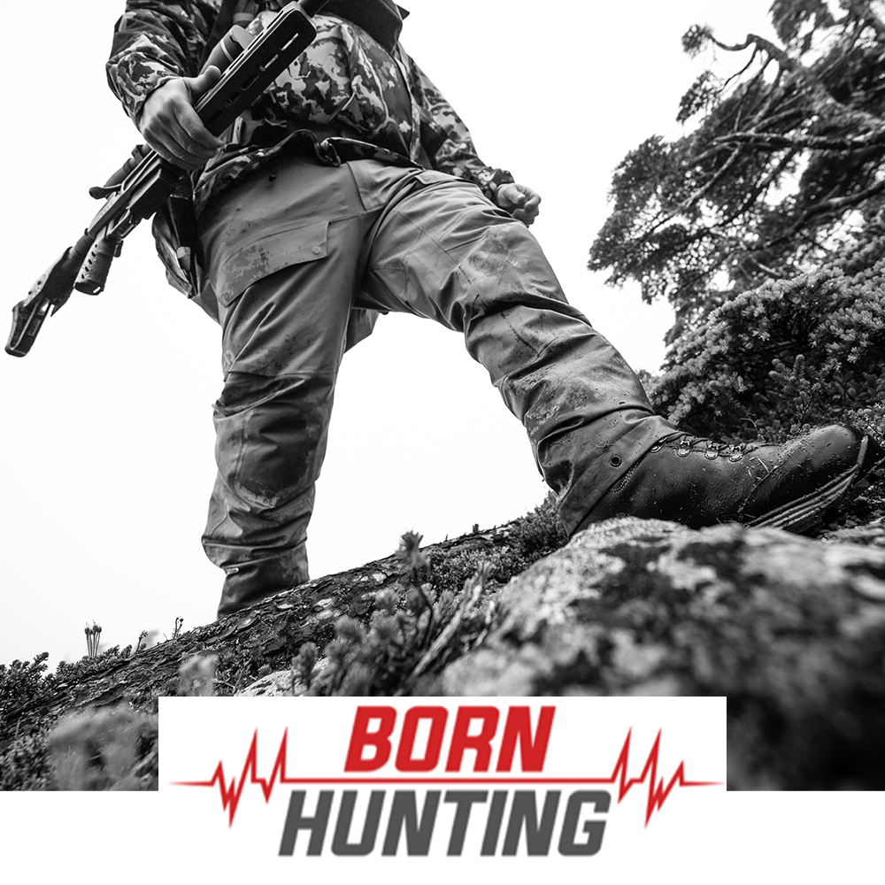 Meindl Comfort Fit Hunter Uninsulated – As Featured in Born Hunting – Uninsulated Leather Hunting Boot Worn by Hunter in Camouflage Stepping Over Mossy Log While Carrying Bow in Forest Setting