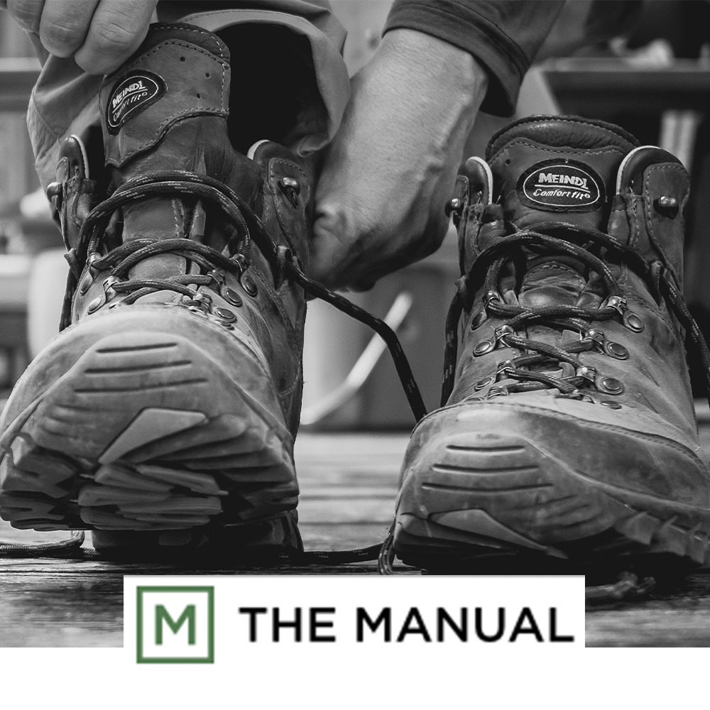 Meindl Comfort Fit Light Hiker - Photo of Well-Worn Brown Leather Hiking Boots Being Laced Up As Featured In The Manual