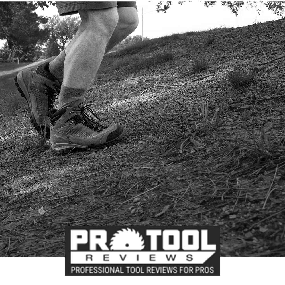 Meindl Comfort Fit Salo Trail Mid – As Featured in Pro Tool Reviews – Lightweight Trail Mid Hiking Shoe Worn by Hiker Walking Uphill on Dry Dirt Trail in Shorts and Hiking Socks