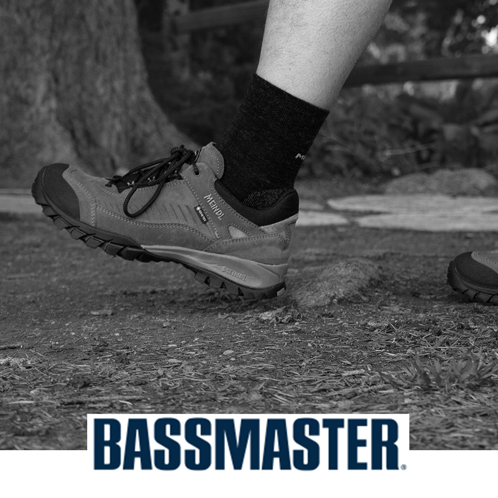 Meindl Comfort Fit Toskana Trail Walker – As Featured in Bassmaster Magazine – Gore-Tex Trail Walking Shoe Worn by Angler Stepping on Dock Beside Boat With Meindl Badge Visible and Fishing Cooler in Background