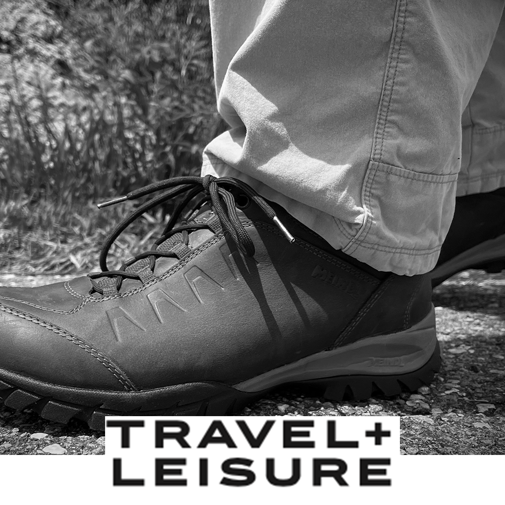Meindl Comfort Fit Walker – As Featured in Travel and Leisure Magazine – Full-Grain Leather Walking Shoe Close-Up Showing Vibram Outsole and Side Profile on Gravel Path