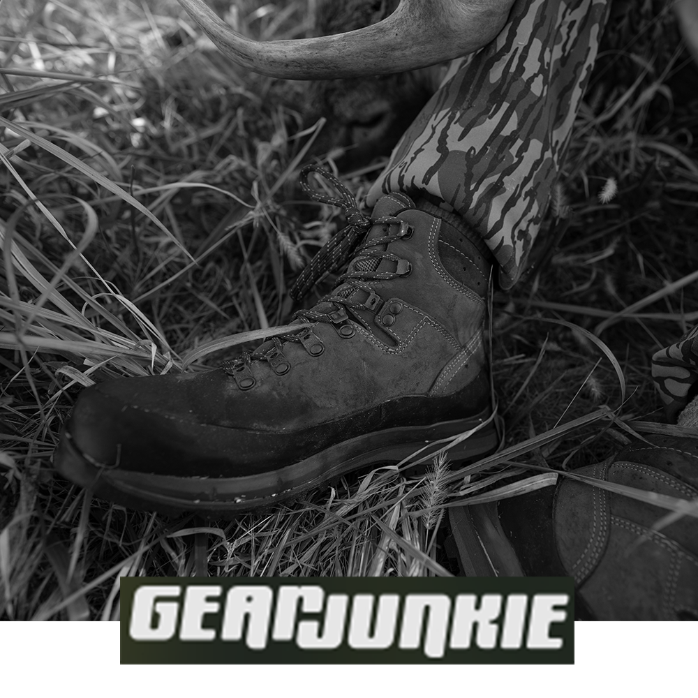 Meindl MFS Vakuum Hiker – As Featured in Gear Junkie – MFS Vakuum Custom-Fit Leather Hiking Boot Worn by Hunter in Camouflage Seated in Tall Grass Beside Elk Antlers