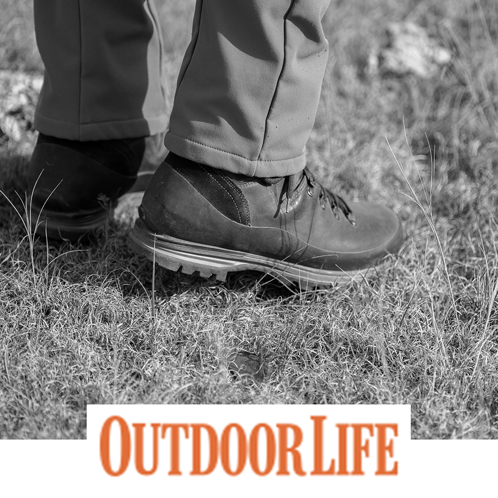 Meindl MFS Vakuum Hunter – As Featured in Outdoor Life – Waterproof Leather Hunting Boot Worn by Hunter Standing in Dry Grass Field Terrain
