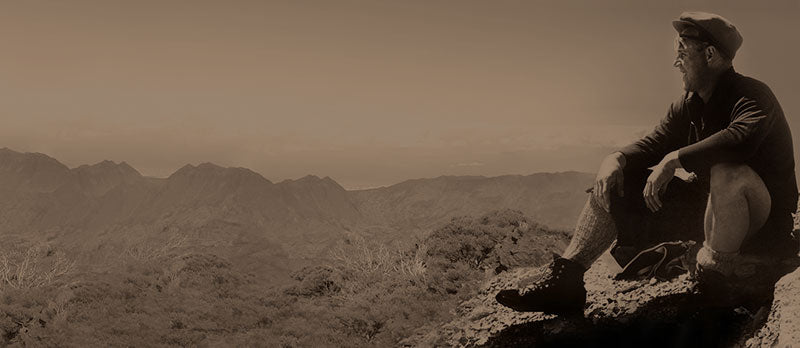vintage image of a man sitting in the mountains